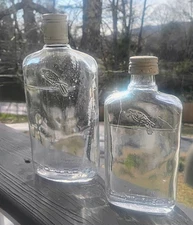 Two Vintage Old Crow Whiskey Bottles Embossed Distillery Liquor