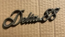 77-85 Oldsmobile Delta 88 Chrome Fender Emblem Nameplate OEM(1)