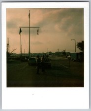 Vtg Polaroid Snapshot Photo Men Flagpole Harbor Marina Parking Lot Cars