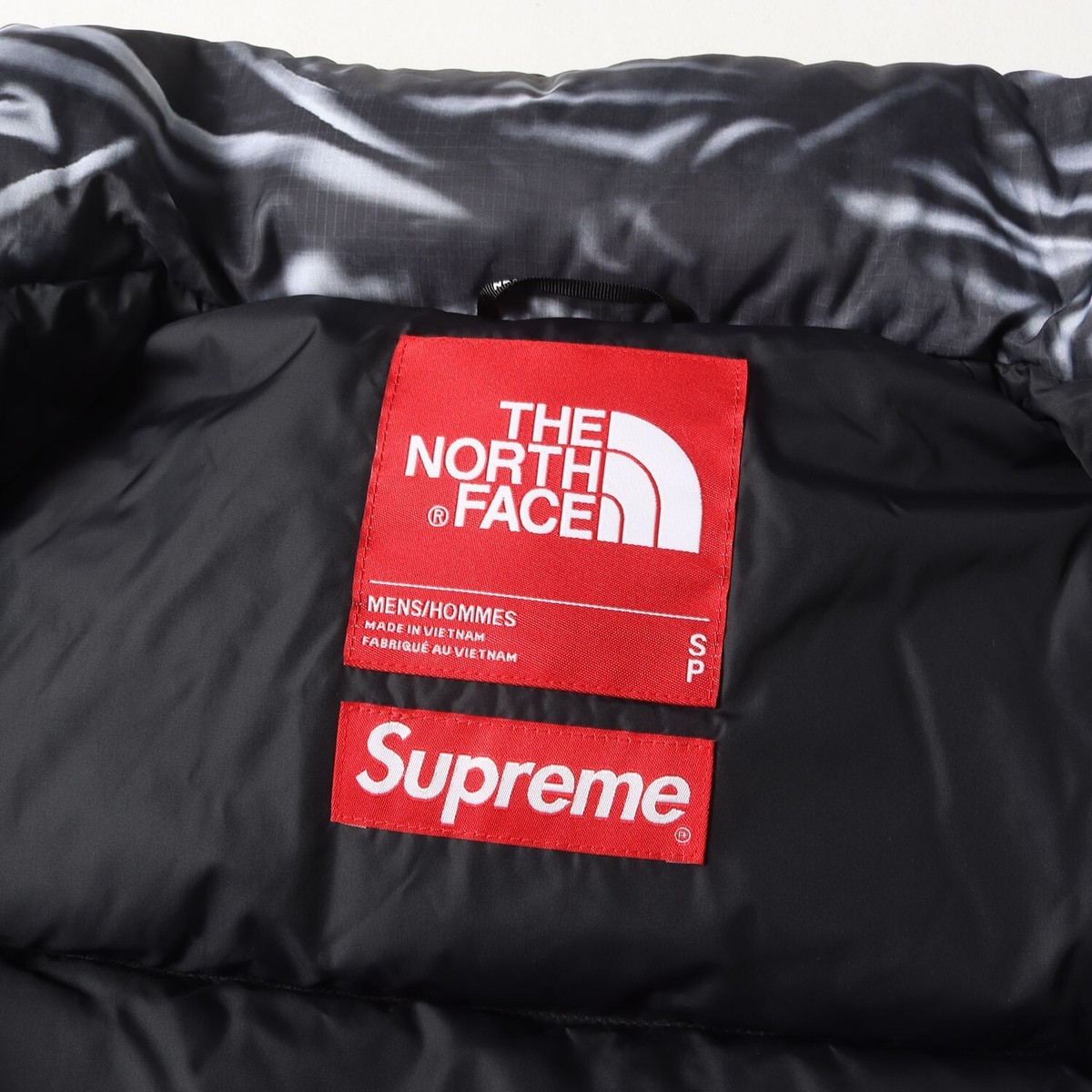 Supreme 23SS THE NORTH FACE Trick Print Nupsi Down Jacket