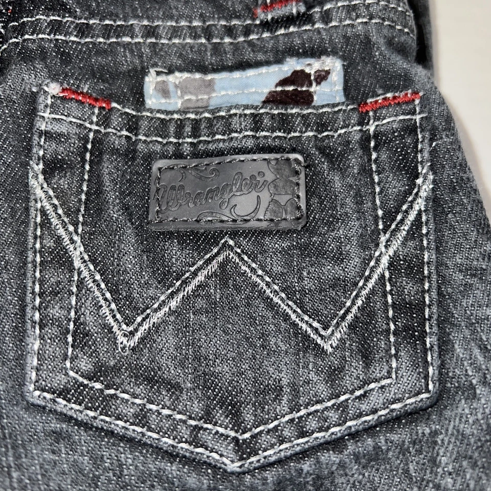 Pantalones de mezclilla vaqueros Wrangler 12 meses negros costuras plateadas herradura Foto 2 de 4