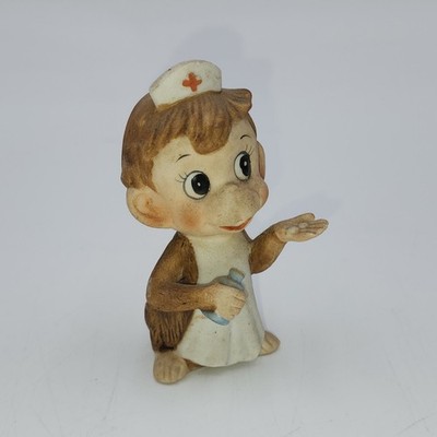 Vintage Monkey Nurse giving out pill medicine ceramic Figurine
