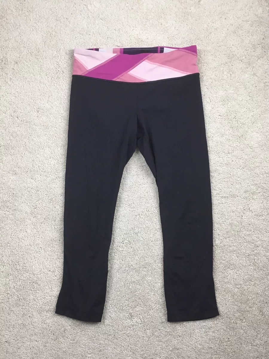 Lululemon leggings size 6 black cropped leggings pink waist back zipper  pocket