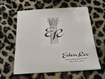The image features a vintage logo for the Eden Roc Miami Beach, a legendary...