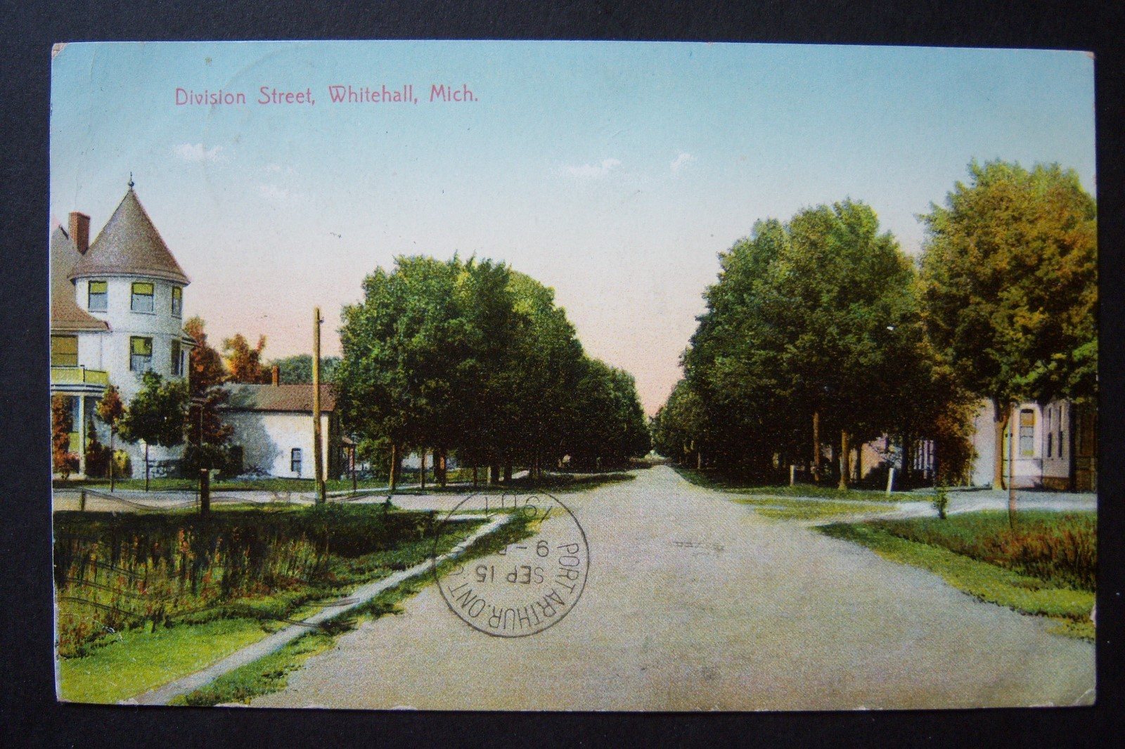 DIVISION STREET, WHITEHALL Michigan postcard, postmarked 1907, Slocum