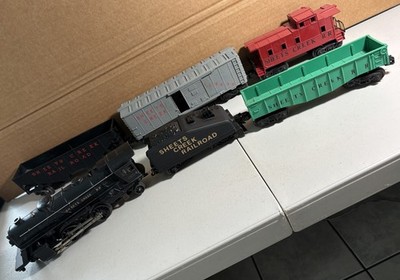 POSTWAR LIONEL 1654 LOCOMOTIVE, TENDER, & 4 CARS ''SHEETS CREEK RAILROAD''