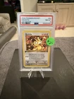 2000 Pokemon TCG Meowth 62/82 Team Rocket 1st Edition PSA 8