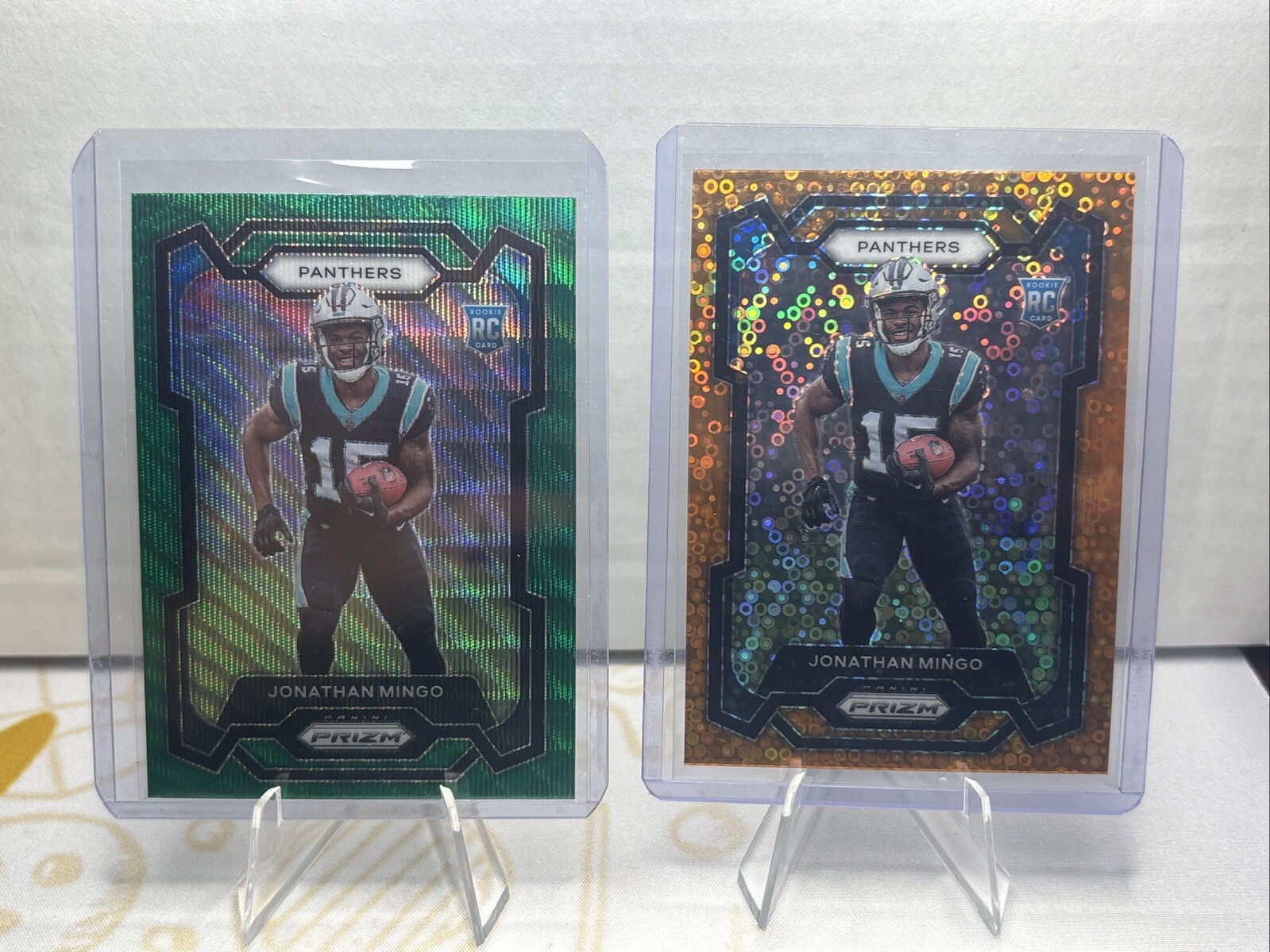 JONATHAN MINGO (2)- 2023 Panini Prizm Orange Disco/Green Wave RC #312 - DALLAS