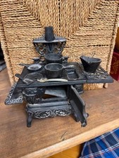 Vintage crescent cast iron miniature wood stove