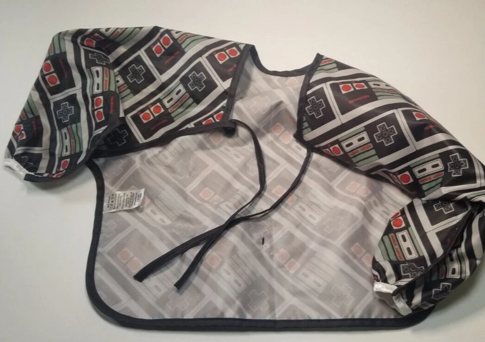 Baberos impermeables con mangas Bumkins Nintendo NES 6-24 meses LICENCIA OFICIAL Foto 2 de 4