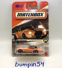 MATCHBOX 2025 1965 Shelby Cobra 427 Super Chase With Sterling￼ Protector
