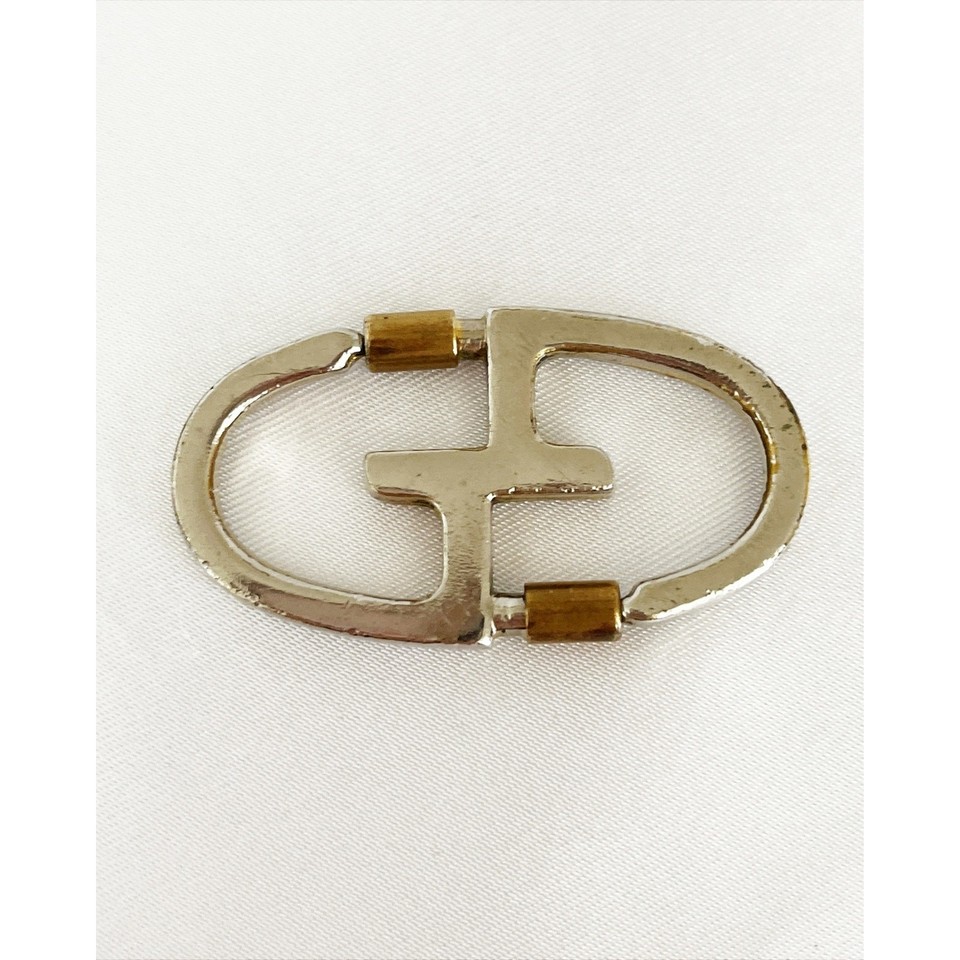 A rare 1970s Gucci silver-and-gold keychain — a genuine luxury vintage artifact that carries the understated flex of pre-logo-mania Gucci craftsmanship.