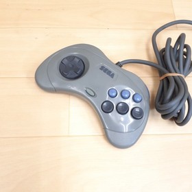 Sega Saturn console with Virtua Gun, Hori Fighting Stick, 2 controllers &3 Games