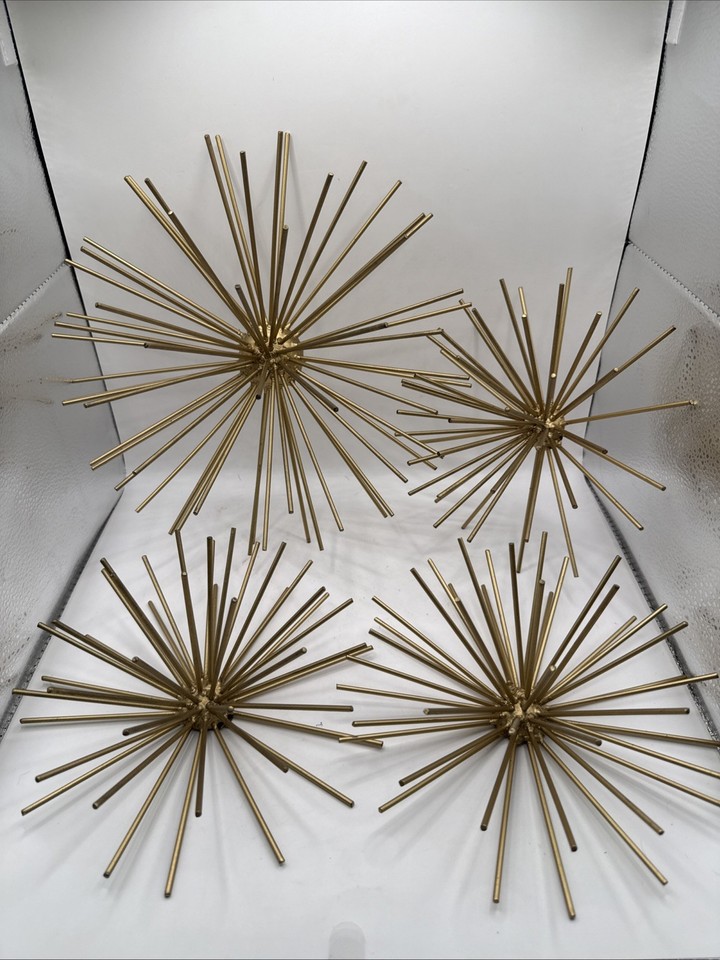 A set of four atomic-age metal urchin burst wall sculptures — pure Sputnik-era energy in a rare multi-piece grouping.
