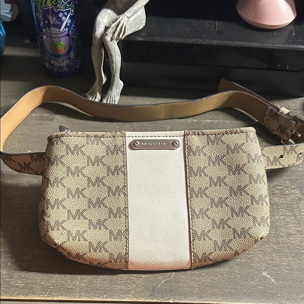 Michael Kors belt bag in the signature MK logo print with a white central stripe