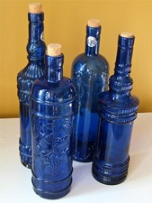 Lot of 4 Cobalt Blue Glass Bottles with Corks Embossed Hand Made In Spain