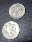 Lot Of (2) 1885p Morgan Silver Dollar AU/BU