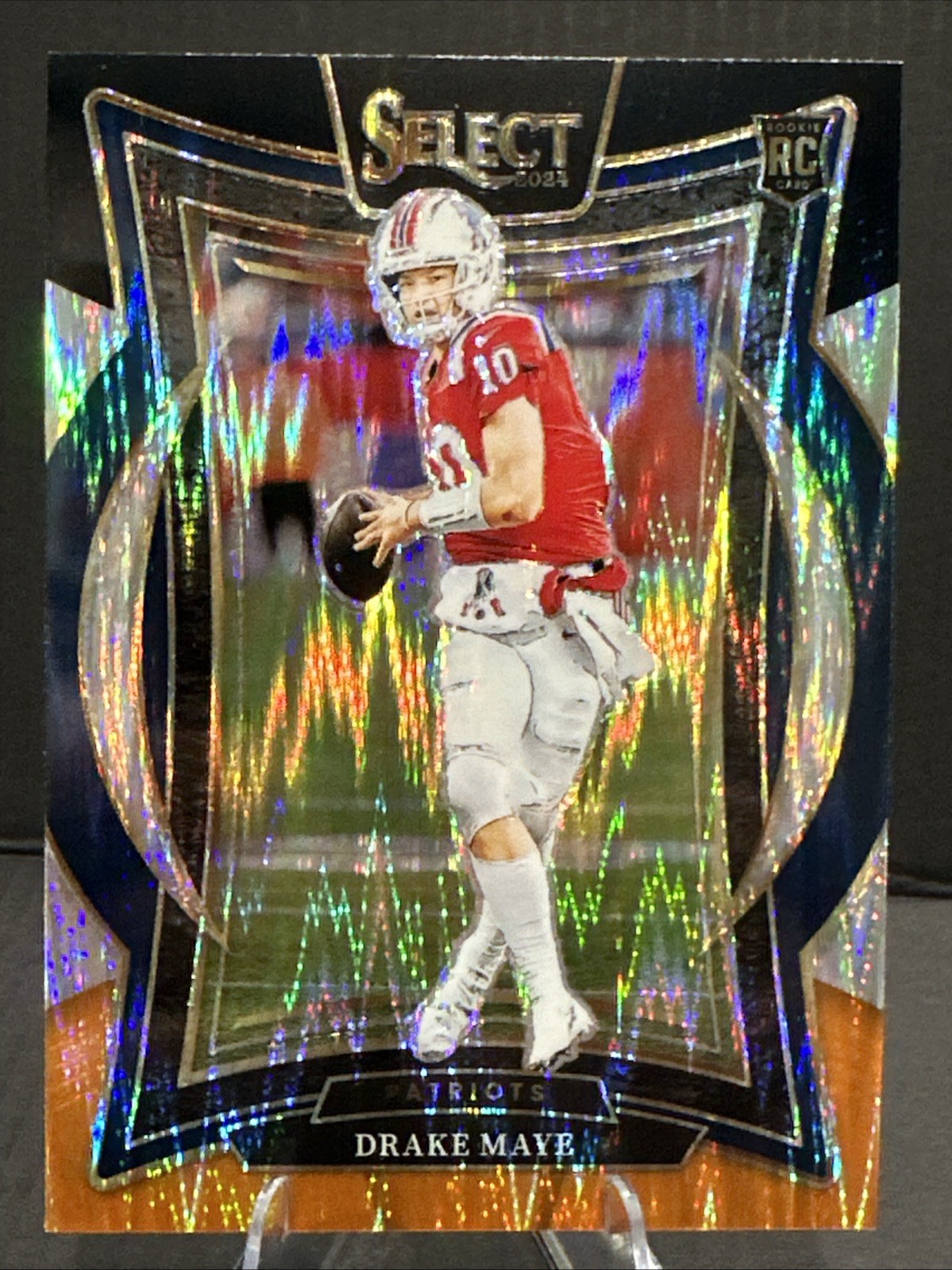 2024 Panini Select - Concourse Drake Maye #27 Black & Orange Shock Prizm (RC)