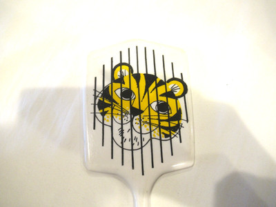Tiger mirror on white background, zoo souvenir, c. 1970s