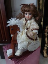 The Leonardo Collection April Porcelain Doll On Rocking Horse In Box