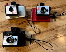 Lot of 3 Polaroid Land cameras. Swinger 20. Square Shooter 2. Red Electric Zip