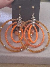 Triple hoop orange glass bead dangle drop earrings