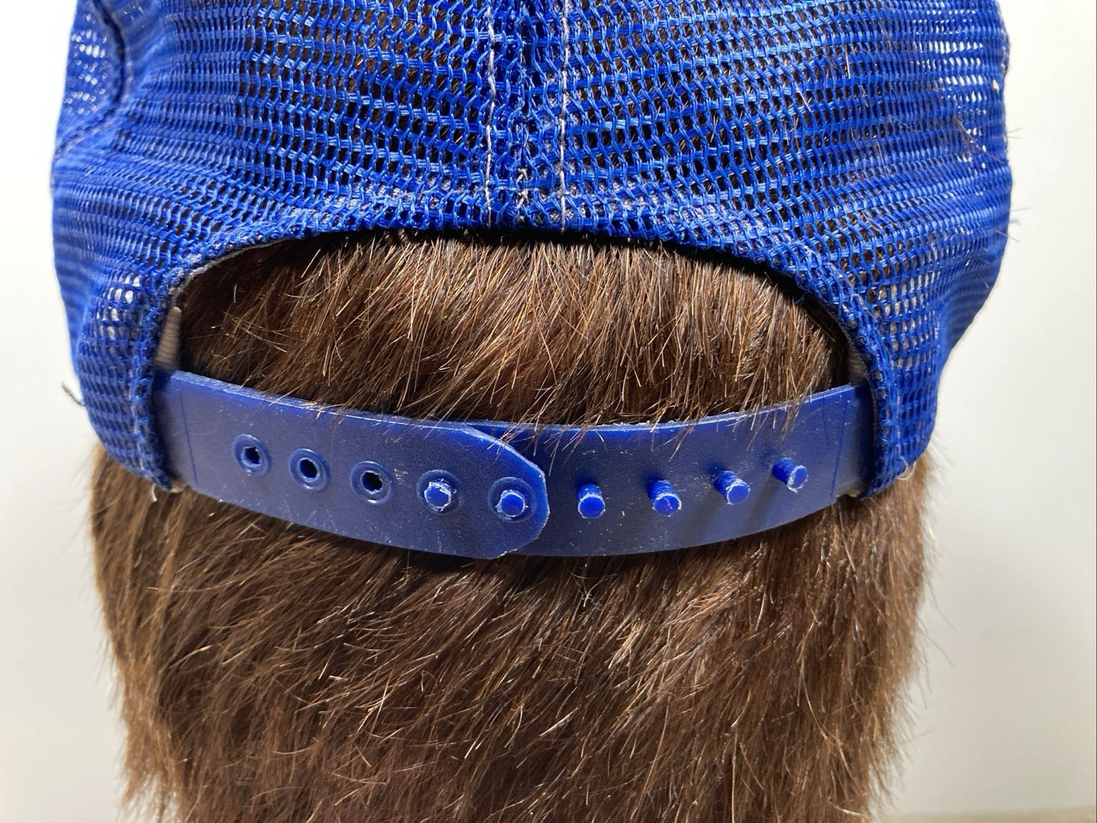 Blue VTG Chicago Cubs snapback trucker hat with wide brim and dark blue adjustable strap featuring embroidered text.