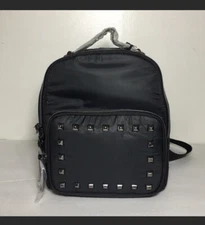 Black mini backpack pyramid stud detail TShirt and Jeans