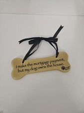 Doggie Wisdom Ceramic Sign  ....but Ly Dog Owns The House  Tan With Black Ribbon