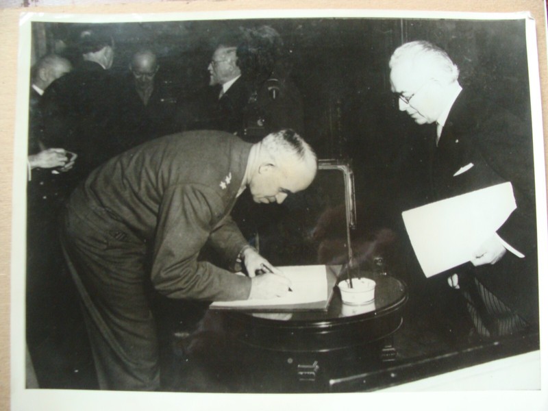 Lt Gen Bradley of 12th US Army w/Eisenhower signs Brussels Register Nov 1944