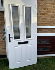 Blue door slab front door white inside cream frame out white in black handles