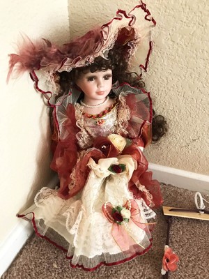 porcelain doll on swing