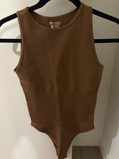 OQQ Women's Brown Ribbed One-Piece Bodysuit Size M Regular, Mild Compression