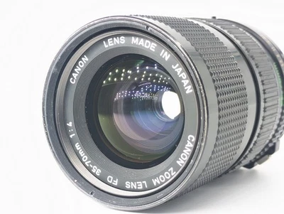 Vidéo*[N COMME NEUF] Objectif zoom Canon FD NFD 35-70mm f/4 MF neuf à... - Photo 1/4