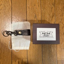 Classic embossed leather key chain brown with storage pouch and box