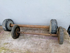 VINTAGE SOLID RUBBER WHEELS AXLES ARE 18 AND 15 INCH INSIDE WHEELS ARE 6 INCH