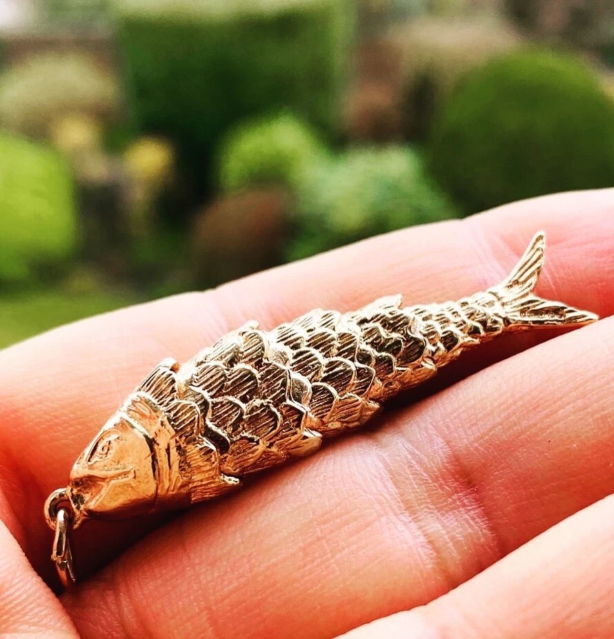 Gold articulated shop fish pendant