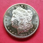 1883-CC MORGAN SILVER DOLLAR. UNCIRCULATED. HIGH GRADE.