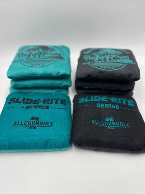 A FULL SET OF BLACK AND TEAL SPENCER MAKENZIE 2019  PROFESSIONAL CORNHOLE BAGS