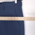 Blue 32 slim-fit THEORY men’s dress pants with front button closure, belt loops, and side pockets, laid flat on light surface.