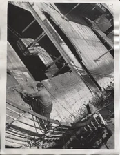 1948 Press Photo Ship Workman at Edge w Cutting Torch Removing Bombed Area
