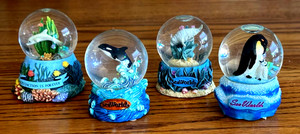 Set of 4 Seaworld Snow Globes - dolphin, orca, manatee and penguin (mother/baby)