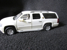 Luxury 143 White Chevy Surburban W Opening Doors.