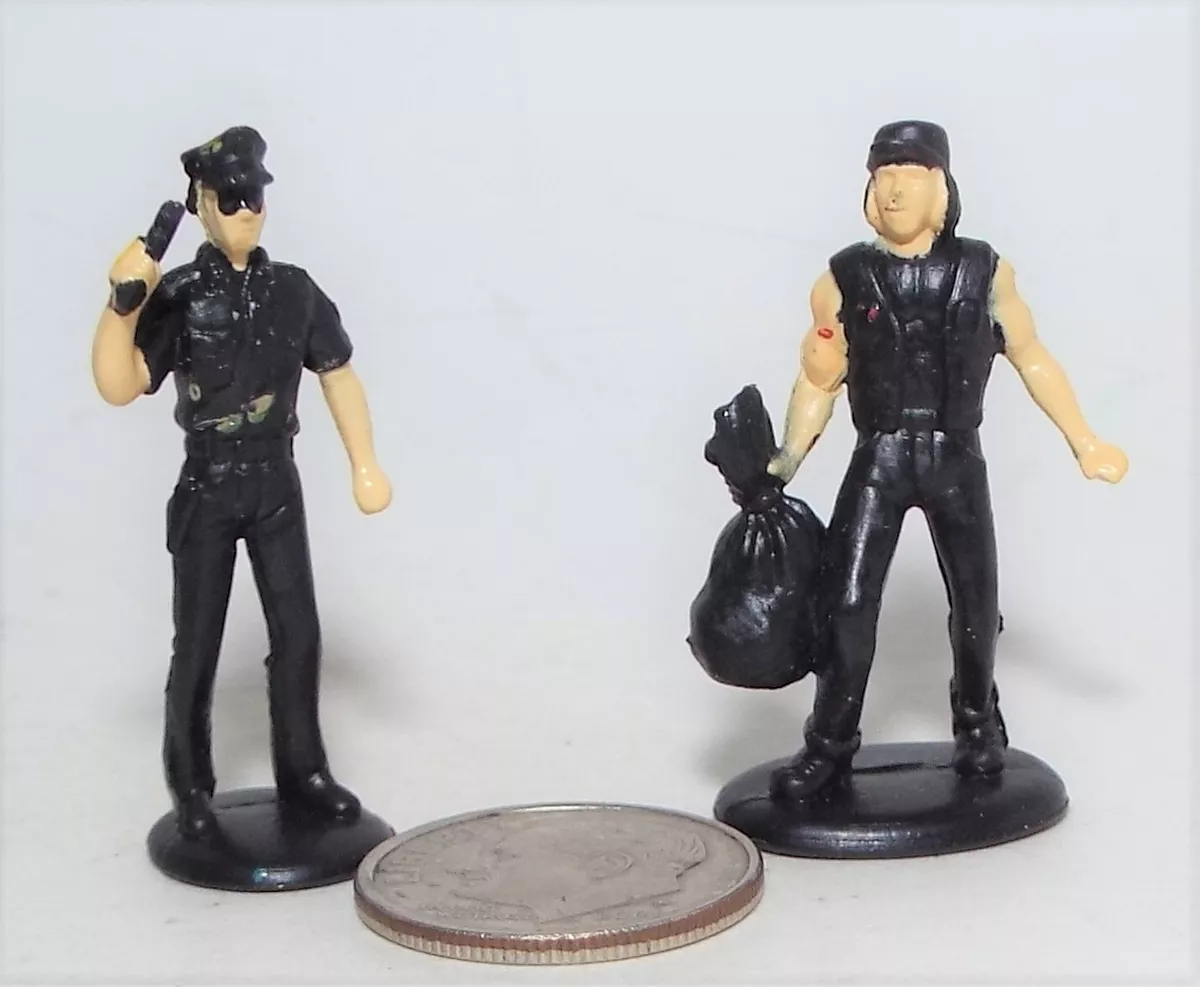 Very Small Plastic Figure of a Police Officer and a Crook with a Bag of Loot