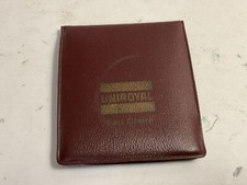 Vintage uniroyal tires Eau Claire Wi. pocket wallet solar Unisonic calculator