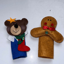 Two Christmas felt finger puppets - a bear with a stocking and a gingerbread man