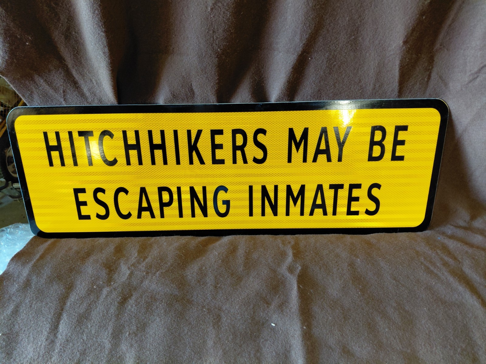 Texas Road Sign "Hitchhikers May Be Escaping Inmates" Metal Reflective 12" X 36"