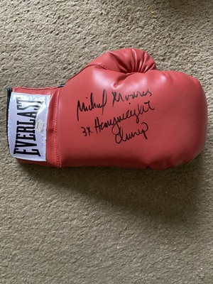 Michael Moorer Signed Boxing Glove. Schwartz Authenticated.