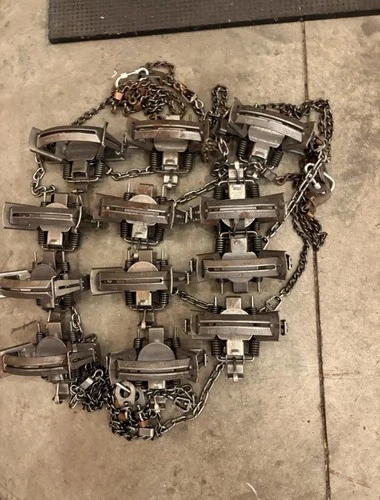 MB - 550,  4 Coil Spring Traps With Cast , Off Set Jaws.  1 Dozen Traps.