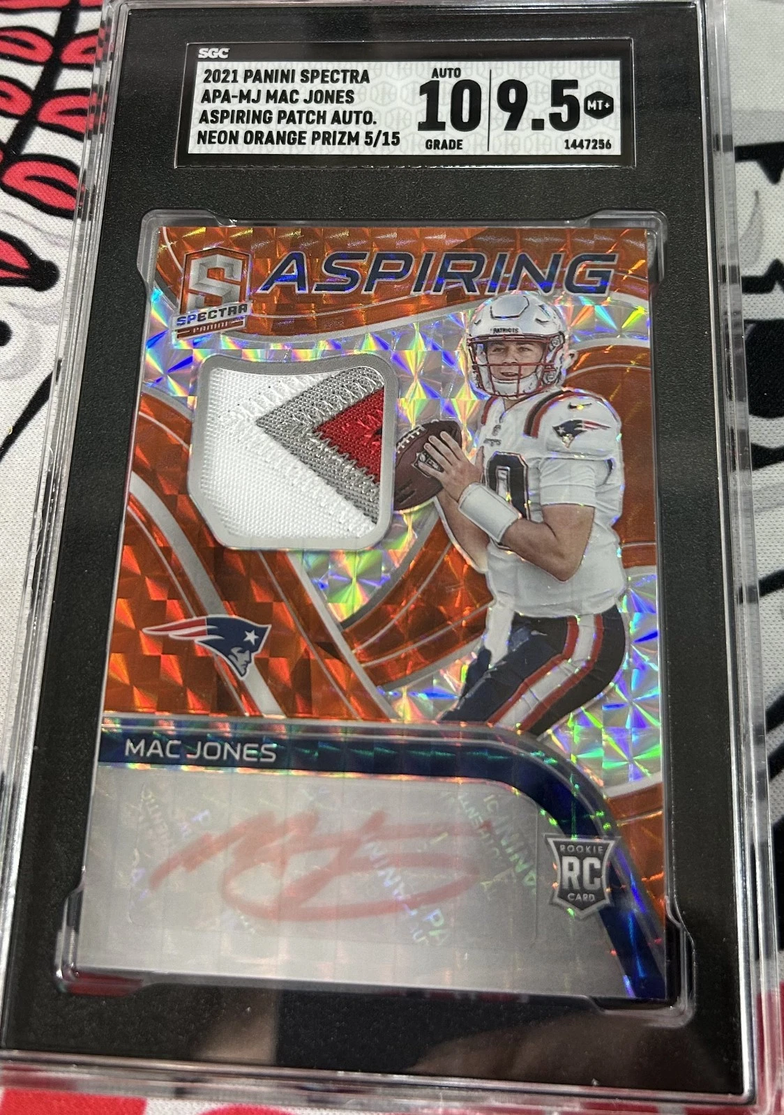 Mac Jones Panini Spectra Aspiring Patch Autographs #APAMJ Neon Orange